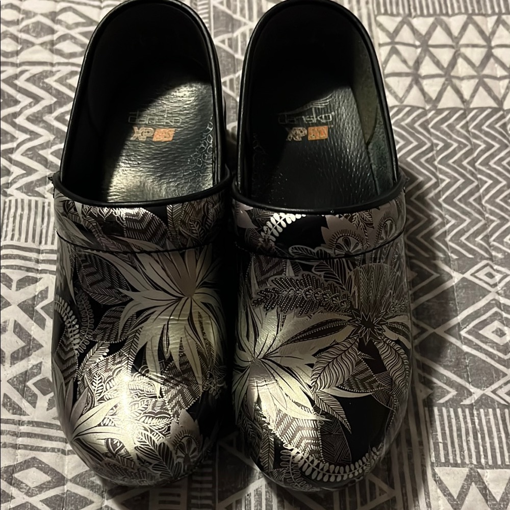 Dansko Black and Silver Clogs.  Size 37.  Some wear.